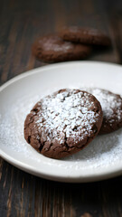 sugared chocolate cookies on plate