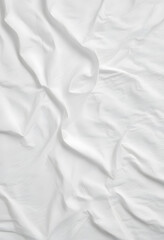 Close-up of white fabric with natural wrinkles and folds, creating a textured and minimalistic background suitable for various design uses.
