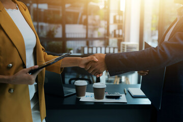 Business handshake for teamwork of business merger and acquisition,successful negotiate,hand shake,two businessman shake hand with partner to celebration partnership and business deal concept