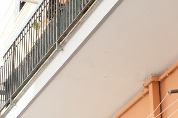 Plaster damage indicates water infiltration from the terrace above