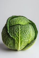 Fototapeta premium Green Cabbage with Veined Texture Isolated on White Background Minimalist Composition Simple Food Photography