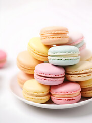 Close up of sweet pastel macaroons on a plate, blurry background 