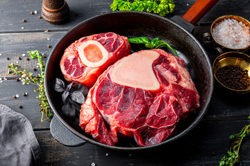  Raw osso buco beef and spices for its preparation
