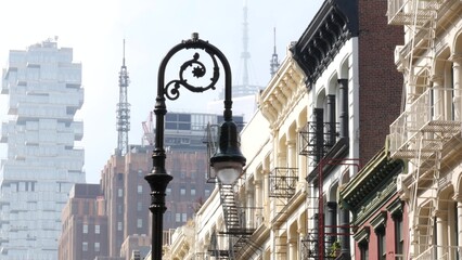 New York City Manhattan Soho fashion district near Broadway street. USA urban building facade, old american architecture. Shopping in NYC, United States. Business and residential real estate. Lantern