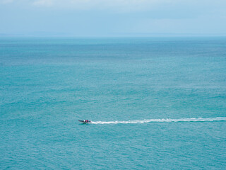 Seascape. A fast-moving boat against the background of the sea. Tor Bay – a bay in England, on the English Channel,La Manche Channel.
