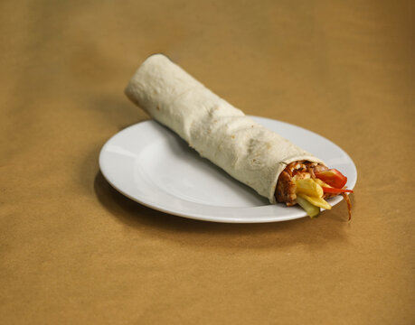 Chicken d&ouml;ner wrap in a plate