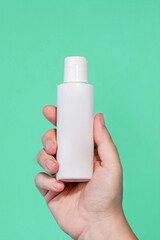 White Blank Lotion Tube on Hand isolated background