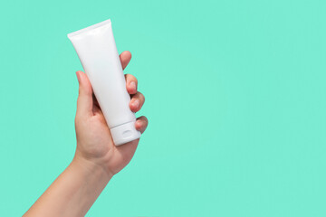 White Blank Lotion Tube on Hand isolated background