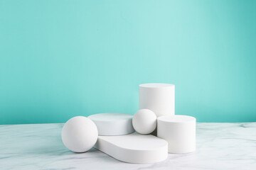 White Stands against turquoise and marble background