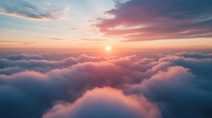 Obraz premium breathtaking aerial view of a sunset sky with layers of wispy clouds in shades of blue pink and gold creating a mesmerizing and ethereal cloudscape