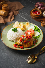Nasi Ayam Geprek is Indonesian Food crispy fried chicken with hot and spicy sambal bawang. Served with rice