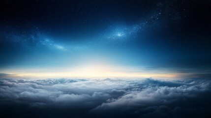 Starry night sky, low horizon, clouds blending with darkness.