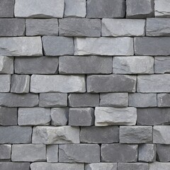 Fototapeta premium The wall is constructed from irregularly shaped, gray stones that fit together in a jigsaw-like pattern