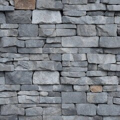 Obraz premium The wall is constructed from irregularly shaped, gray stones that fit together in a jigsaw-like pattern