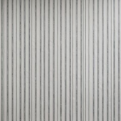 Obraz premium vertical striped pattern on a wall. The stripes are evenly spaced and have a subtle texture, resembling a marble or stone finish