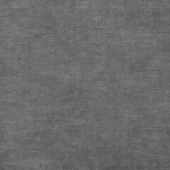 close-up view of a textured surface, likely a piece of fabric or a similar material. The surface is predominantly gray with subtle variations in shading, creating a slightly mottled appearance