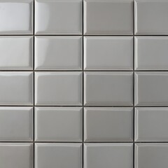 Fototapeta premium close-up view of a tiled wall. The tiles are rectangular in shape and arranged in a grid pattern