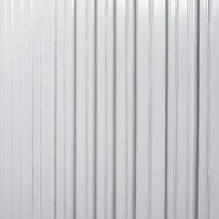 Obraz premium close-up view of a textured surface with a repetitive pattern. The surface is white and features horizontal rows of small, evenly spaced vertical ridges.