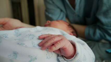 Close-up of a newborn&rsquo;s hand with soft, tiny fingers, capturing the delicate and tender nature of early life. the fragility and beauty of infancy