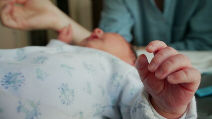 Close-up of a newborn’s hand with soft, tiny fingers, capturing the delicate and tender nature of early life. the fragility and beauty of infancy