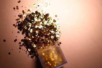 golden shiny glitter on a light brown background