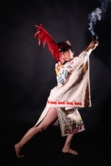 Aztec dance on black background