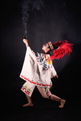 Aztec dance on black background