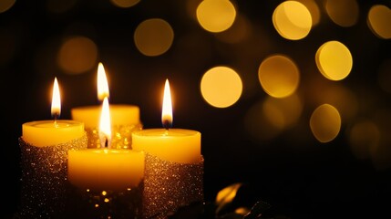 Advent candles glowing in darkness with sparkling flames and blurred abstract lights