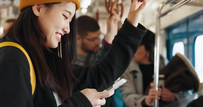 Train, phone and happy Japanese woman for travel, commute and journey on metro transportation in city. Passenger, public transport and person laugh on smartphone for social media, chat and contact