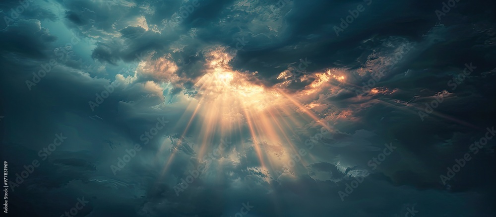 Poster lovely sunlight shines through dark clouds in the evening sky creating a stunning light effect as it