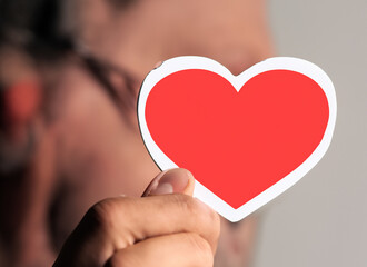 person holding a heart