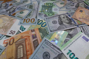 US dollar and euro banknotes background