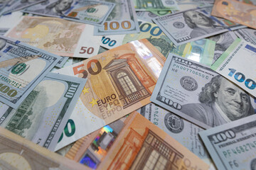 US dollar and euro banknotes background