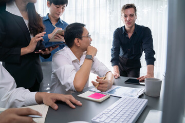 Group of diverse office worker employee working together on strategic business marketing planning in corporate office room. Positive teamwork in business workplace concept. Prudent
