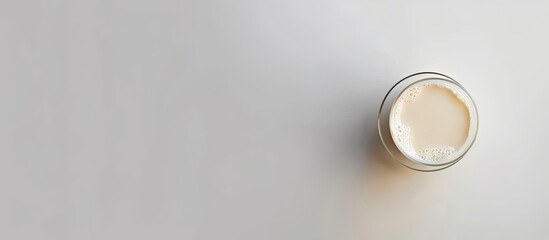A glass of milk against a white background Top view Copy space Isolated