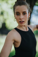 Close-up portrait of a graceful dancer performing modern dance in nature, exuding strength and elegance.