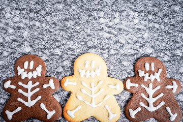 Chocolate and vanilla cookies in a Halloween theme, on a grey background.