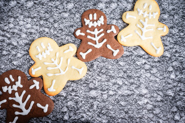 Chocolate and vanilla cookies in a Halloween theme, on a grey background.
