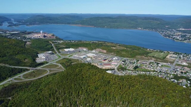 Aerial view at 450m altitude of the estuary of the Restigouche River. Legendary salmon river flowing between the green mountains forming the border between Quebec and New Brunswick.