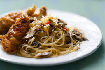 aglio olio pasta with battered fish