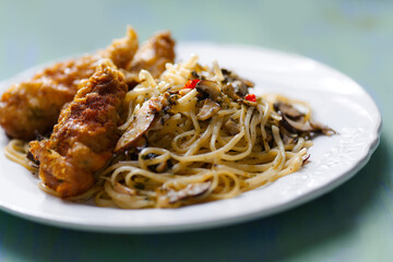 aglio olio pasta with battered fish