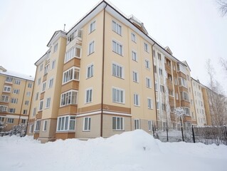 Fototapeta premium Snow covered residential building in winter landscape quiet neighborhood 
