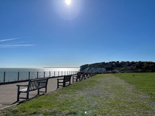 wooden benches beside the sea