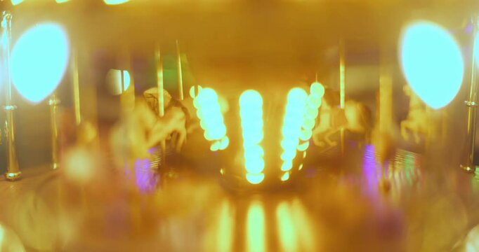 vintage toy horse carrousel in lights cu