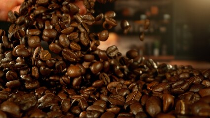 Fototapeta premium Man hands throwing roasted coffee beans.