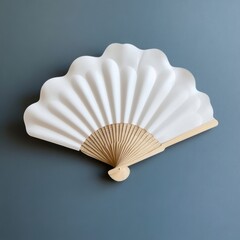 a white fan on a blue wall