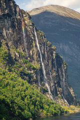 View of a rainbow in the seven sisters waterfall Norway