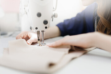Interior of workshop for sewing underwear for women and bra textiles. Modern fashion workroom of seamstresses and dressmakers