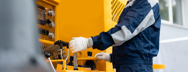 Man builder operate crane or excavator at construction site © Parilov