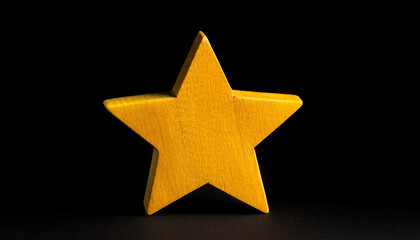 Obraz premium Yellow star isolated on black backdrop. Banner with copy space.